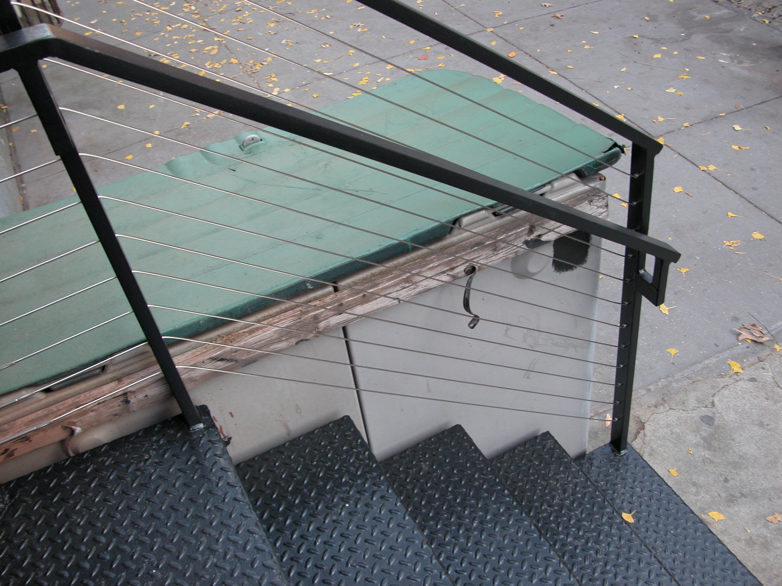 Cable railings with diamond plate stairs at 201 West 13 Street