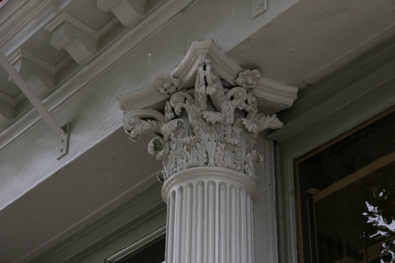 Close-up view of an ornamental column piece from a Manhattan building restored by Jepol Construction, highlighting the attention to detail and craftsmanship in metal restoration work.