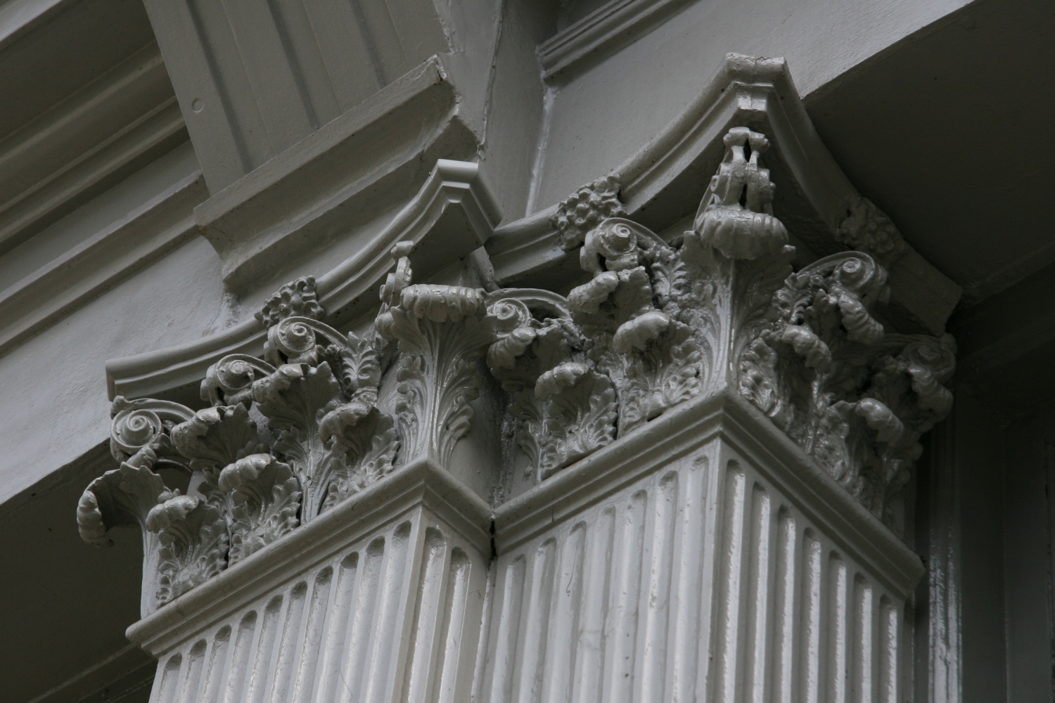 Detailed image of a decorative column element from a historic Manhattan building, demonstrating Jepol Construction's skilled metal restoration and commitment to preserving architectural heritage.