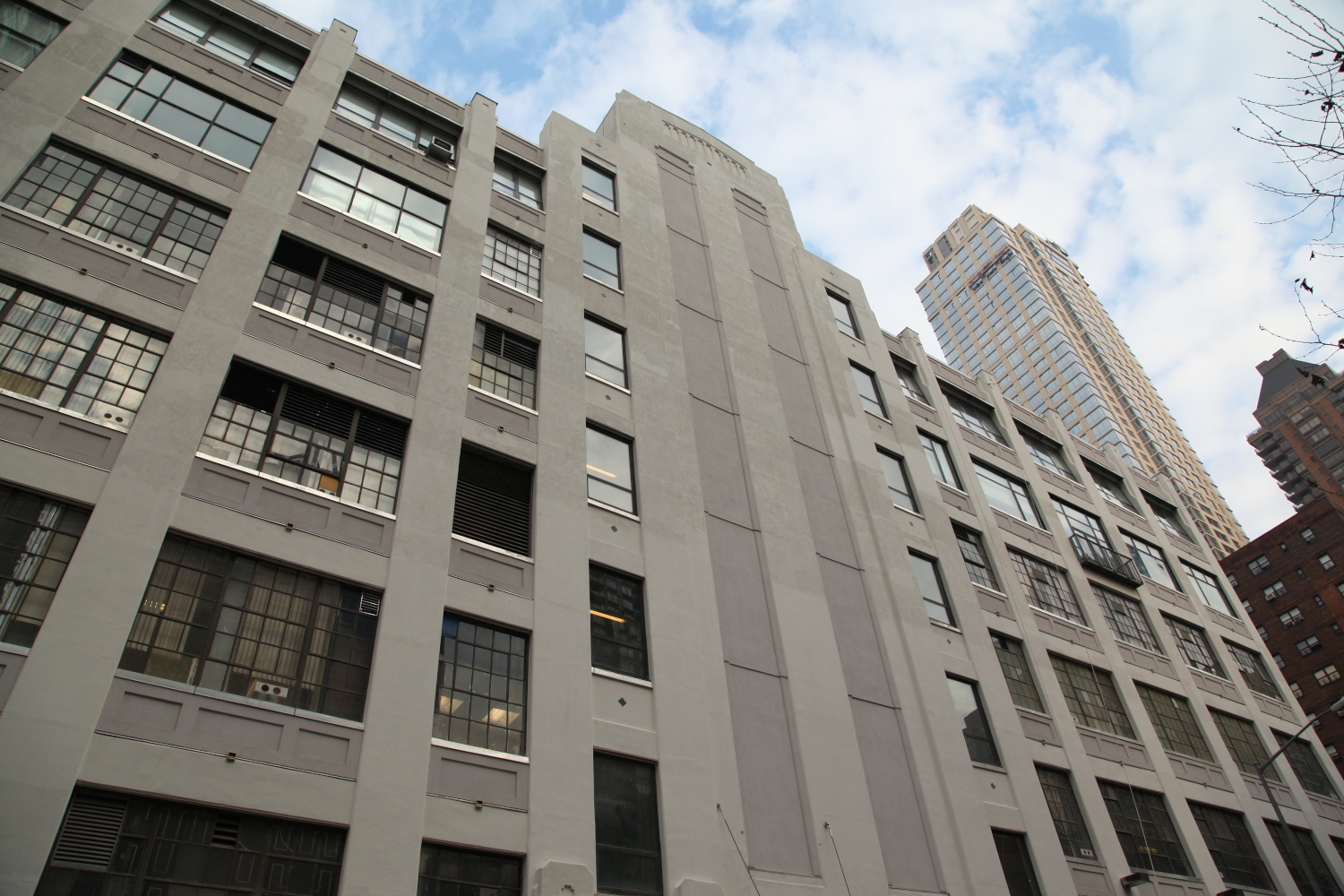 Full view of the renovated 211 West 61st Street building, featuring Jepol Construction's professional concrete repair and stucco restoration, reflecting our expertise in building exterior refurbishment.