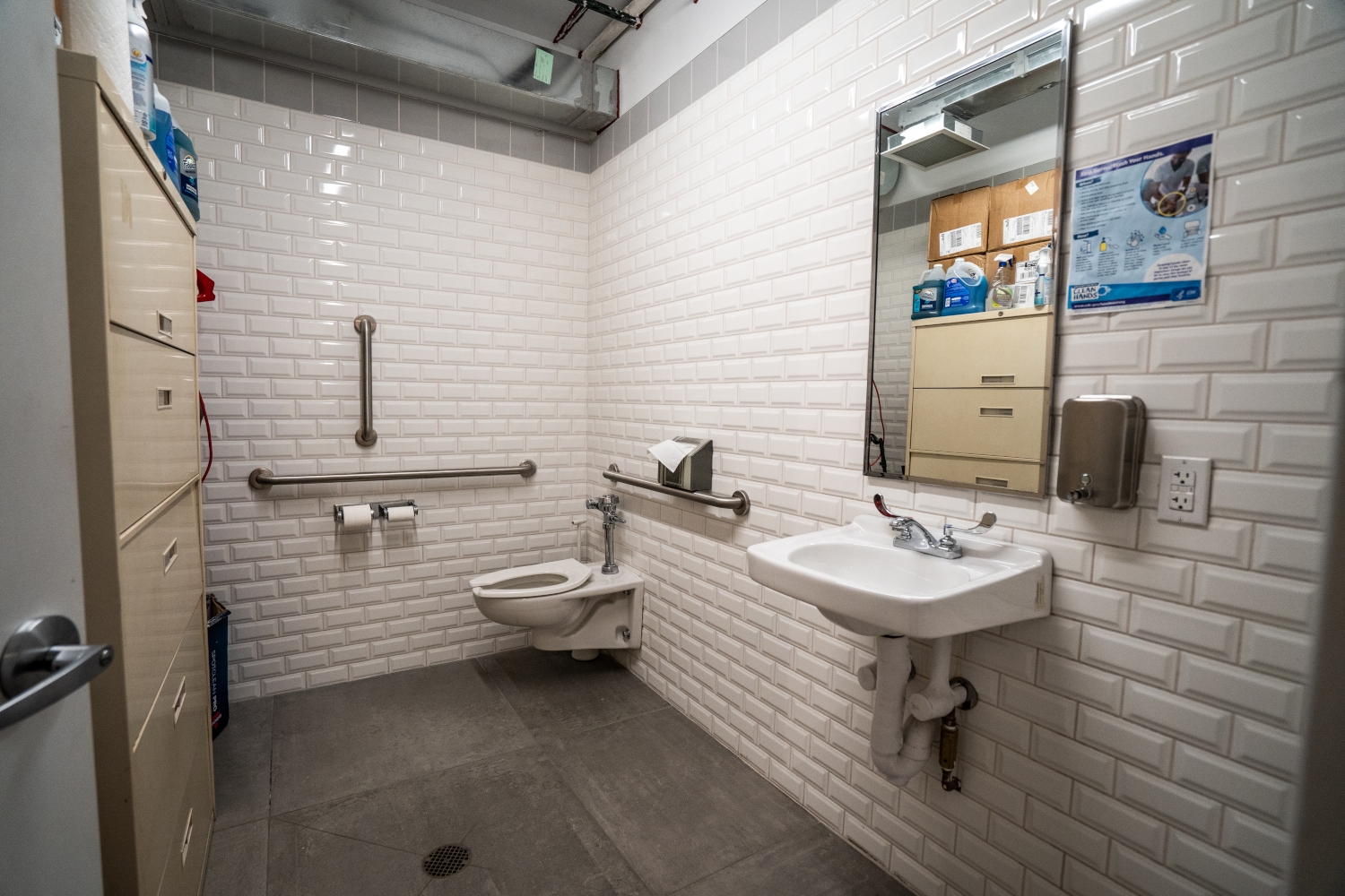 Another view of the renovated modern bathroom in 80 White Street showing new wall and floor tiles, new drains, modern fixtures, and eco-friendly appliances