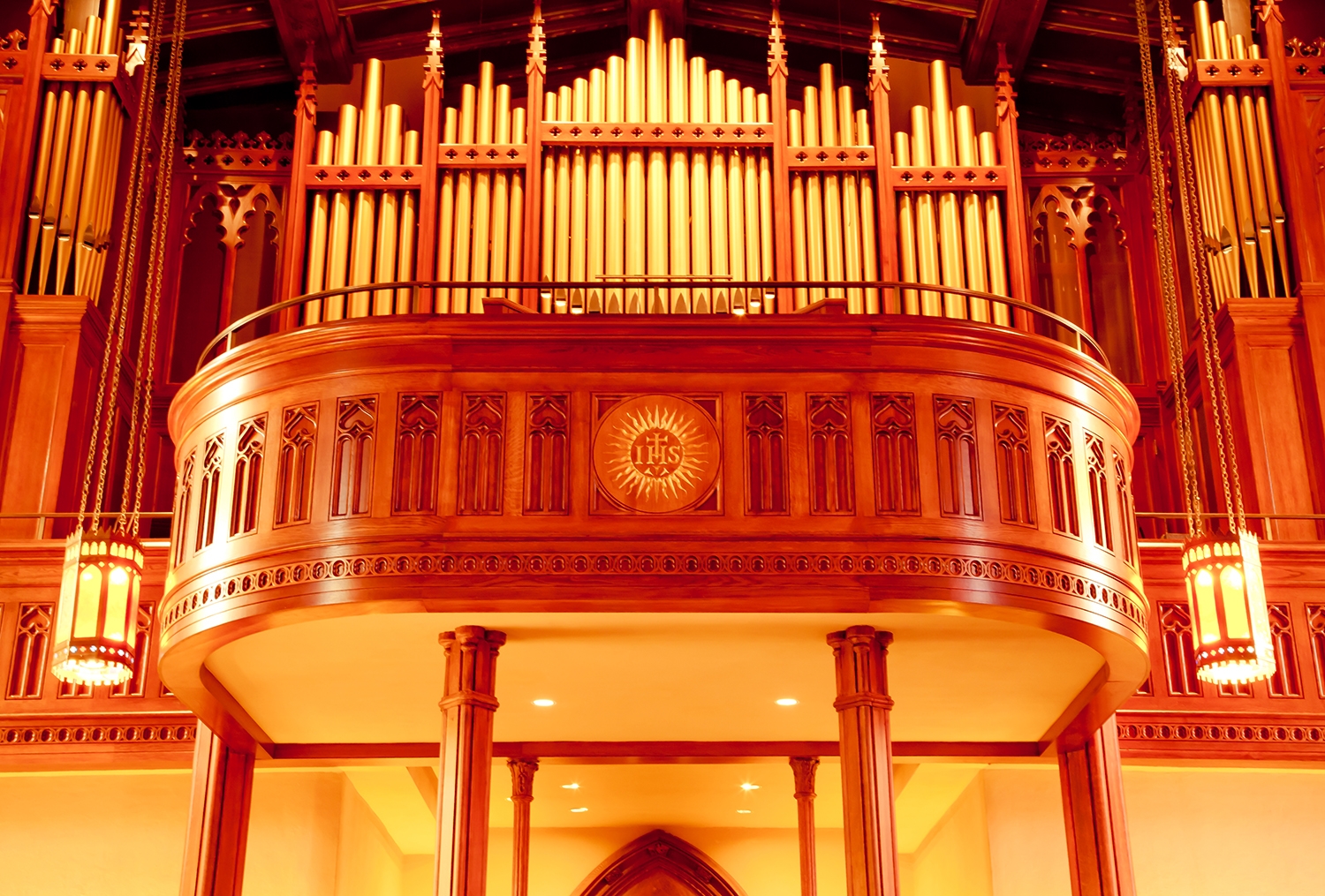 Completed choir stage at Fordham University, featuring beautifully stained and painted wood construction, providing an elegant and functional space for the choir performances