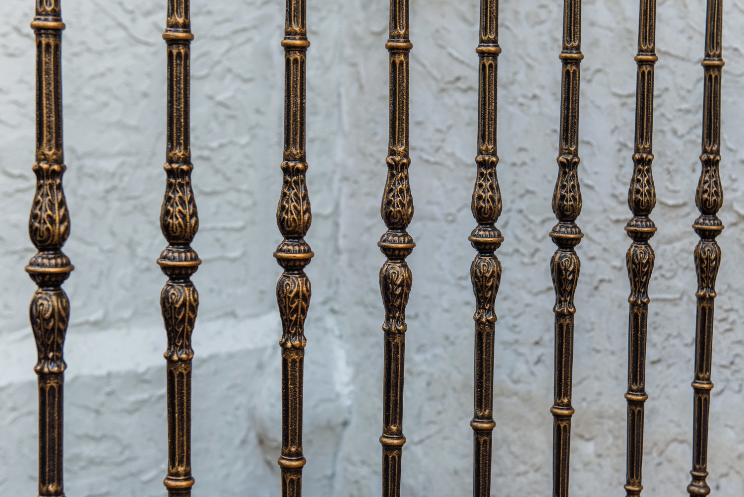 Detailed painting on metal railings at Holy Cross Church in Maspeth, Queens