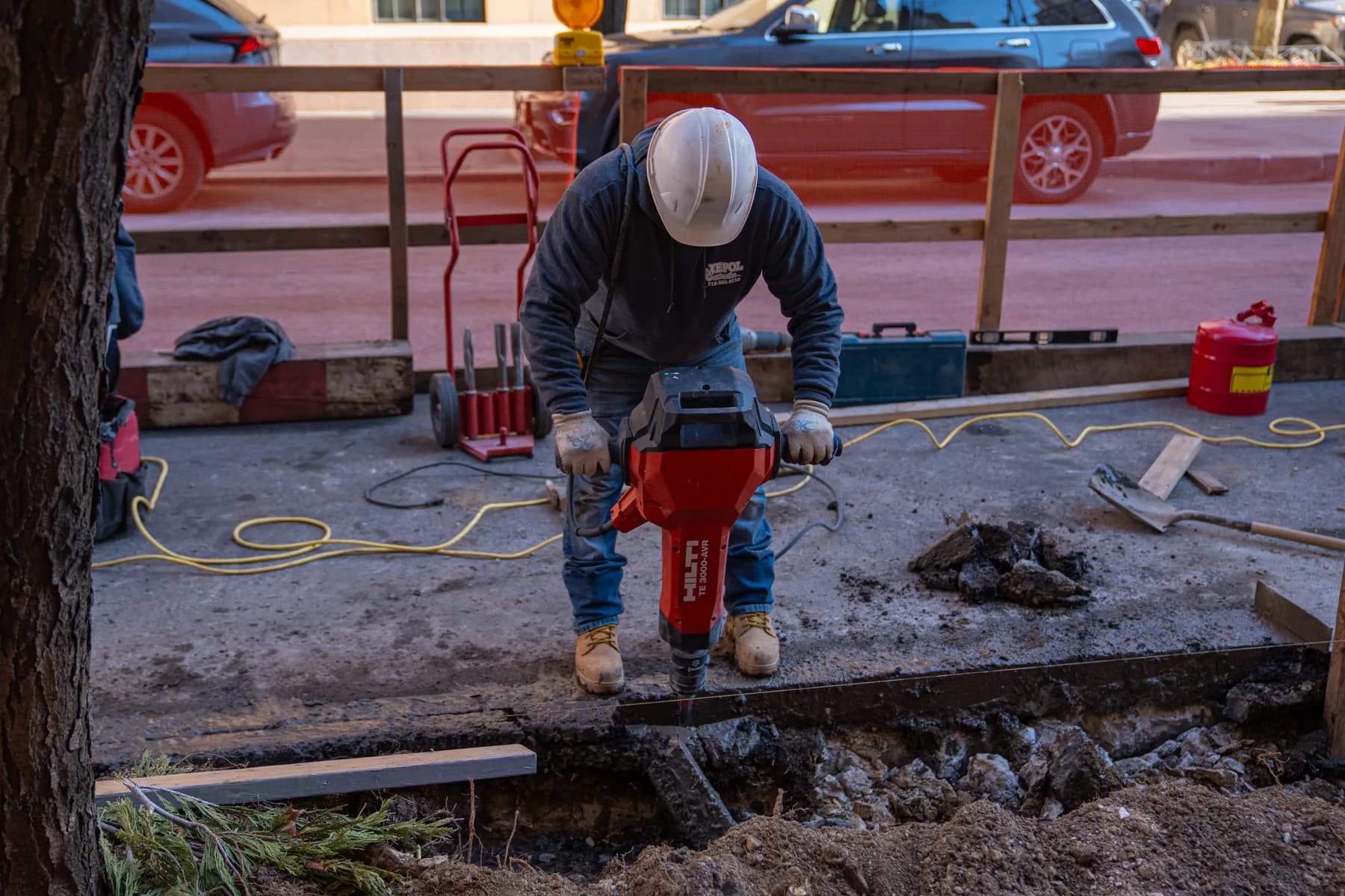 Jepol crew member completing concrete work at the 1088 Park Avenue entrance