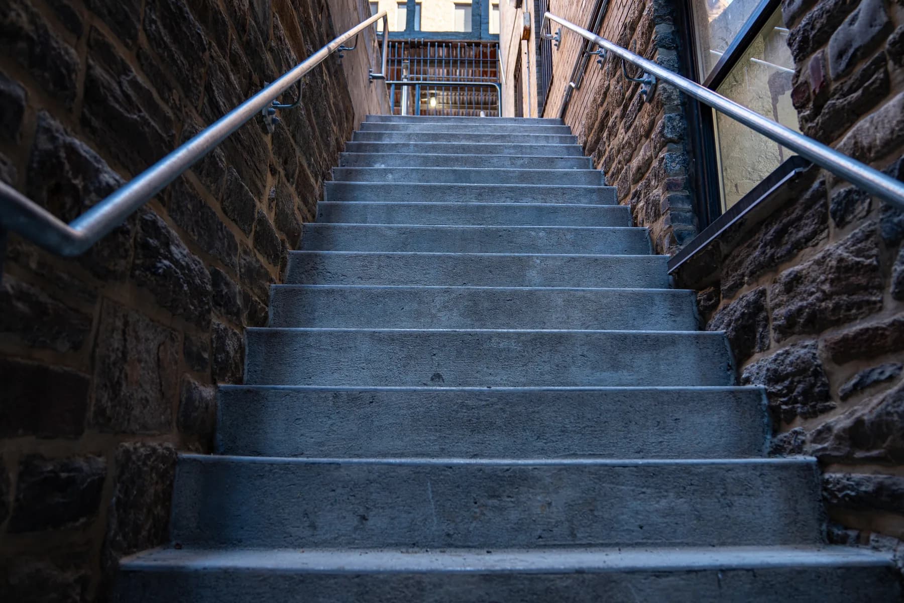 Stone stairway with new stainless-steel handrails at 1088 Park Avenue
