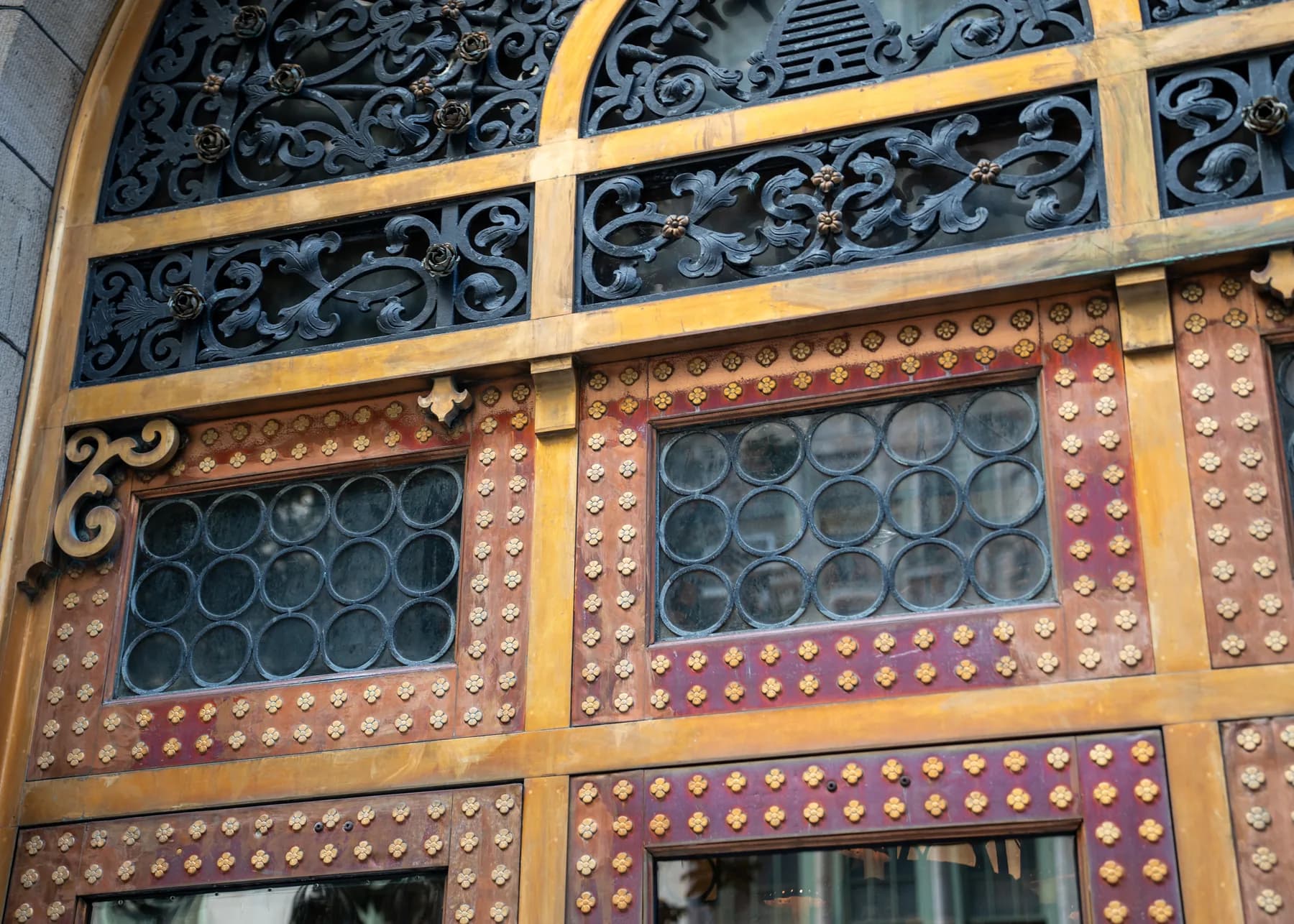 Decorative metal and wood panel details on the 4 Lexington Avenue doors
