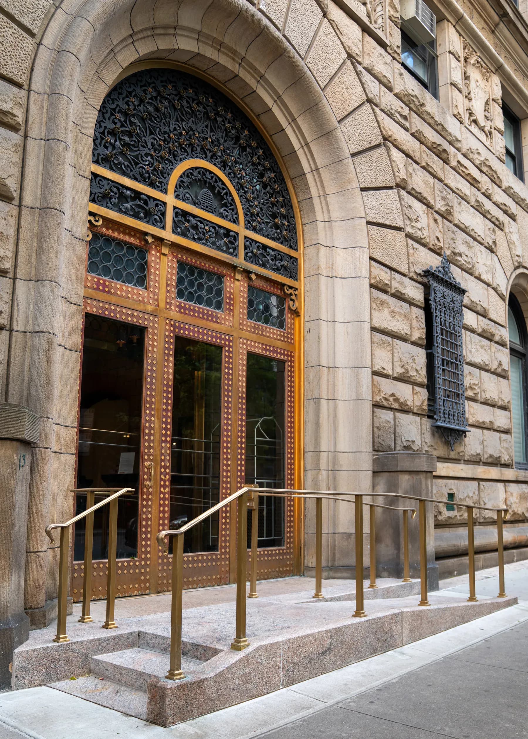 Angled view of the arched entrance and accessible approach