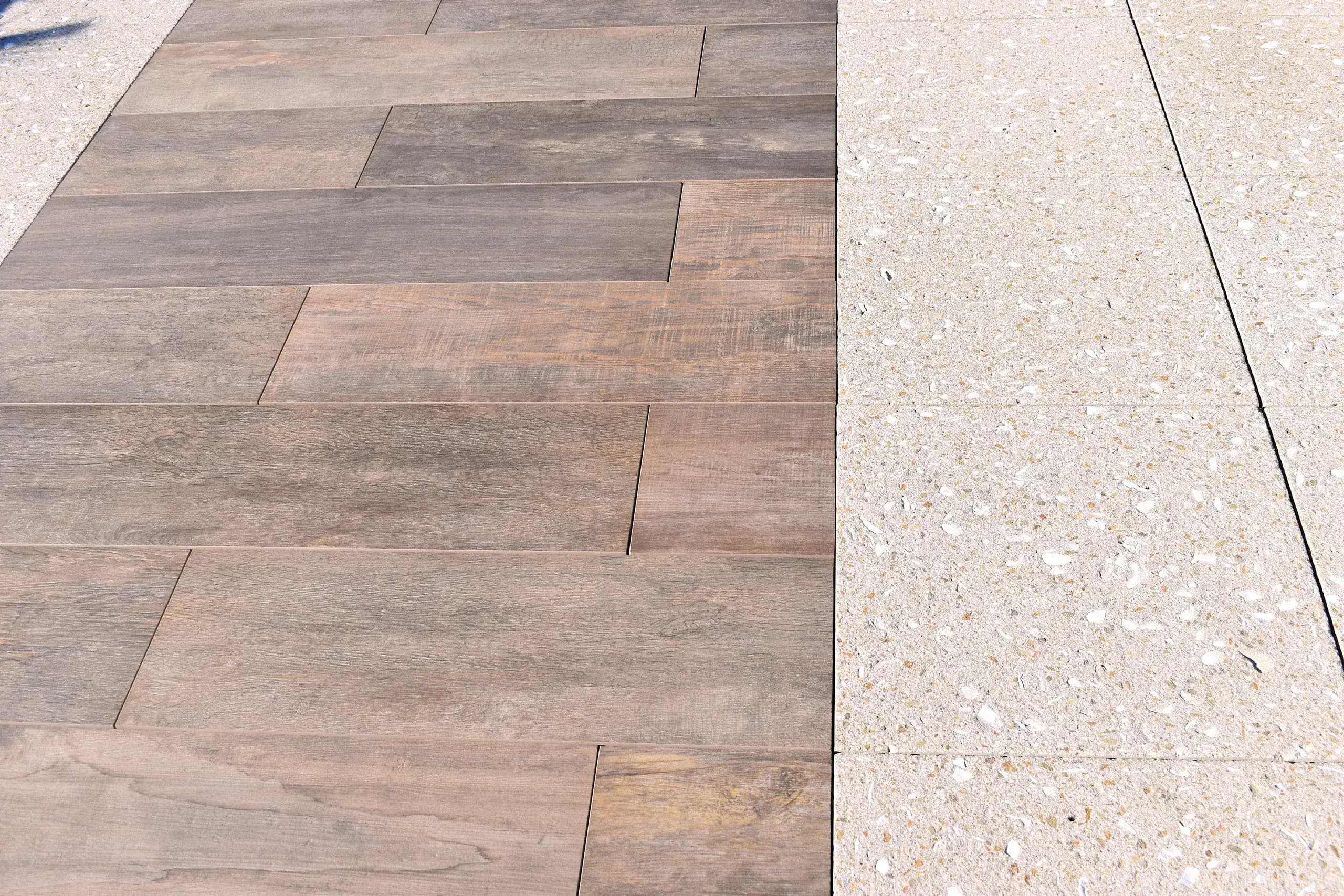 Detail of wood-look and terrazzo-style rooftop pavers