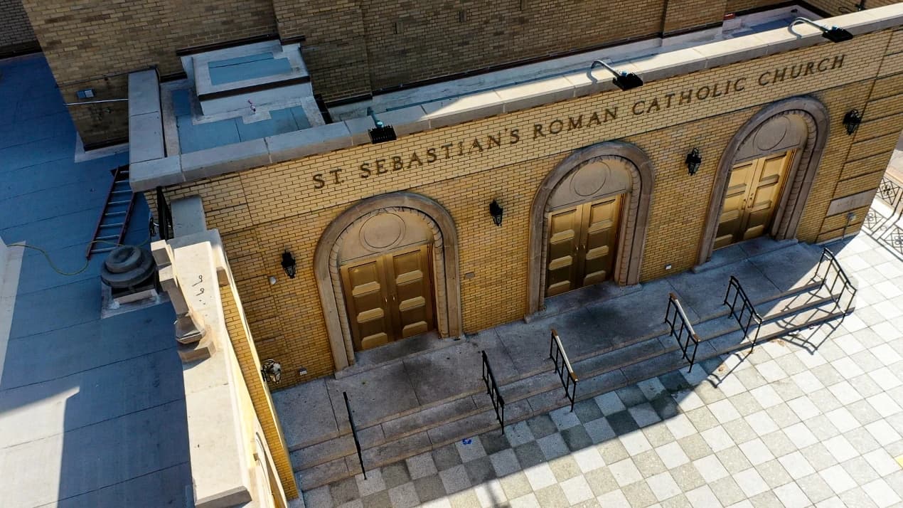 Aerial view of the completed entrances, railings, and pavers