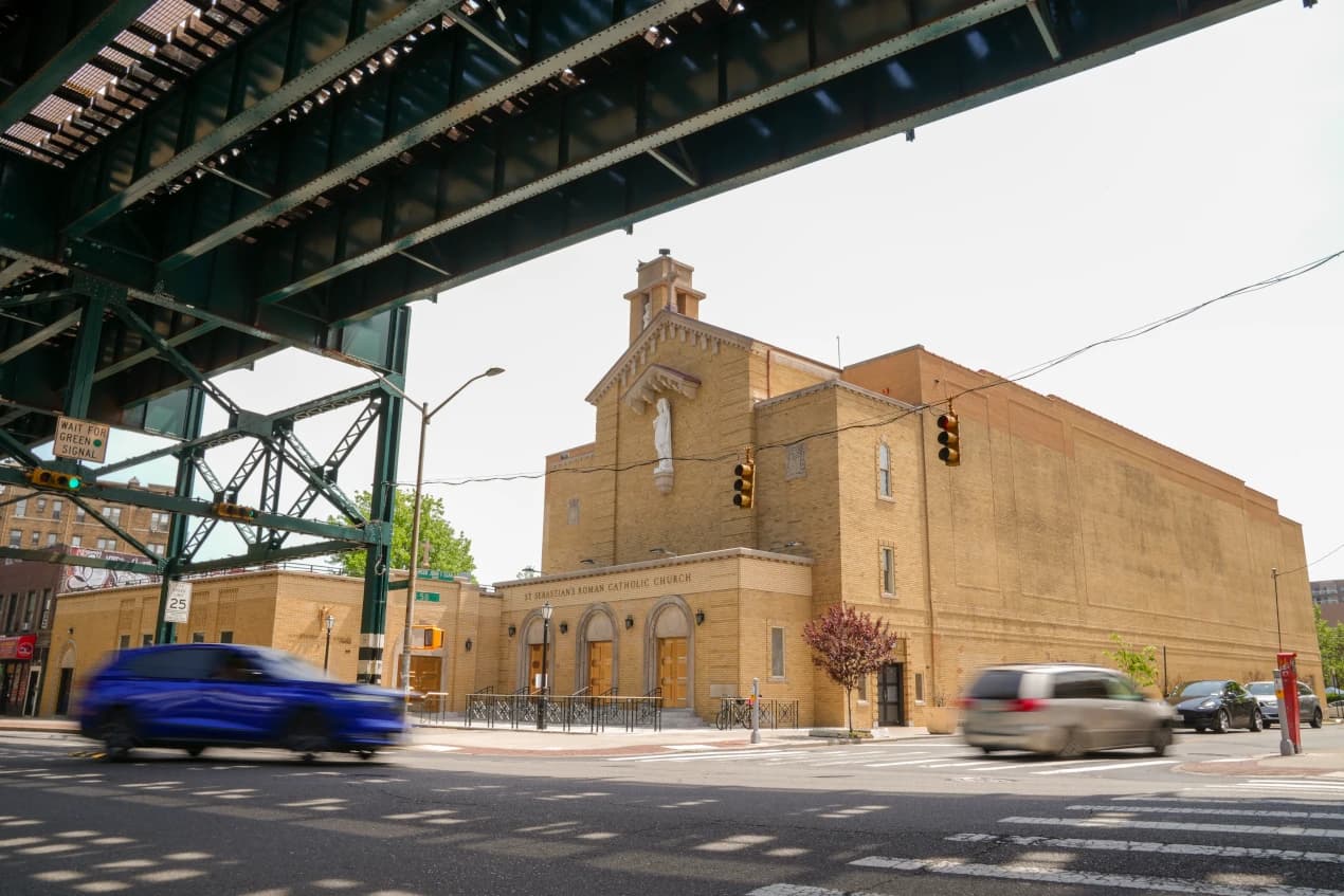 Restored St. Sebastian RC Church beneath the elevated railway in Woodside, Queens