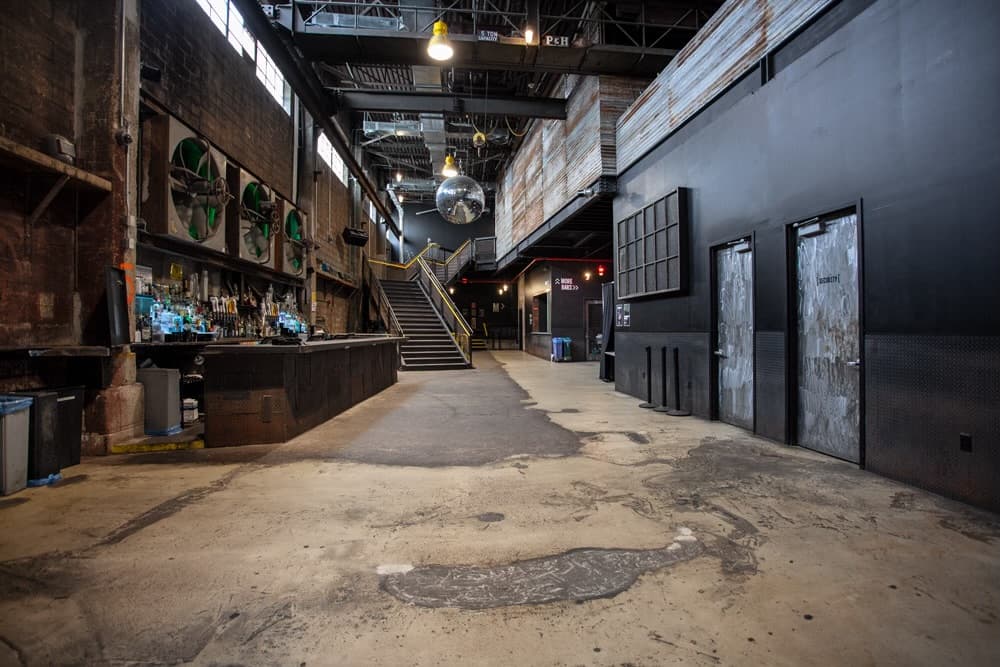 Bar, stairs, and circulation route within Brooklyn Steel