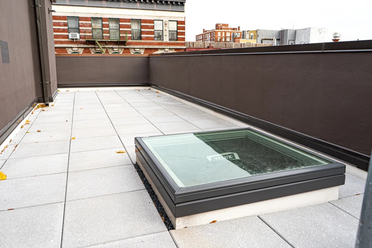 Roof terrace pavers, skylight, and waterproofed parapets