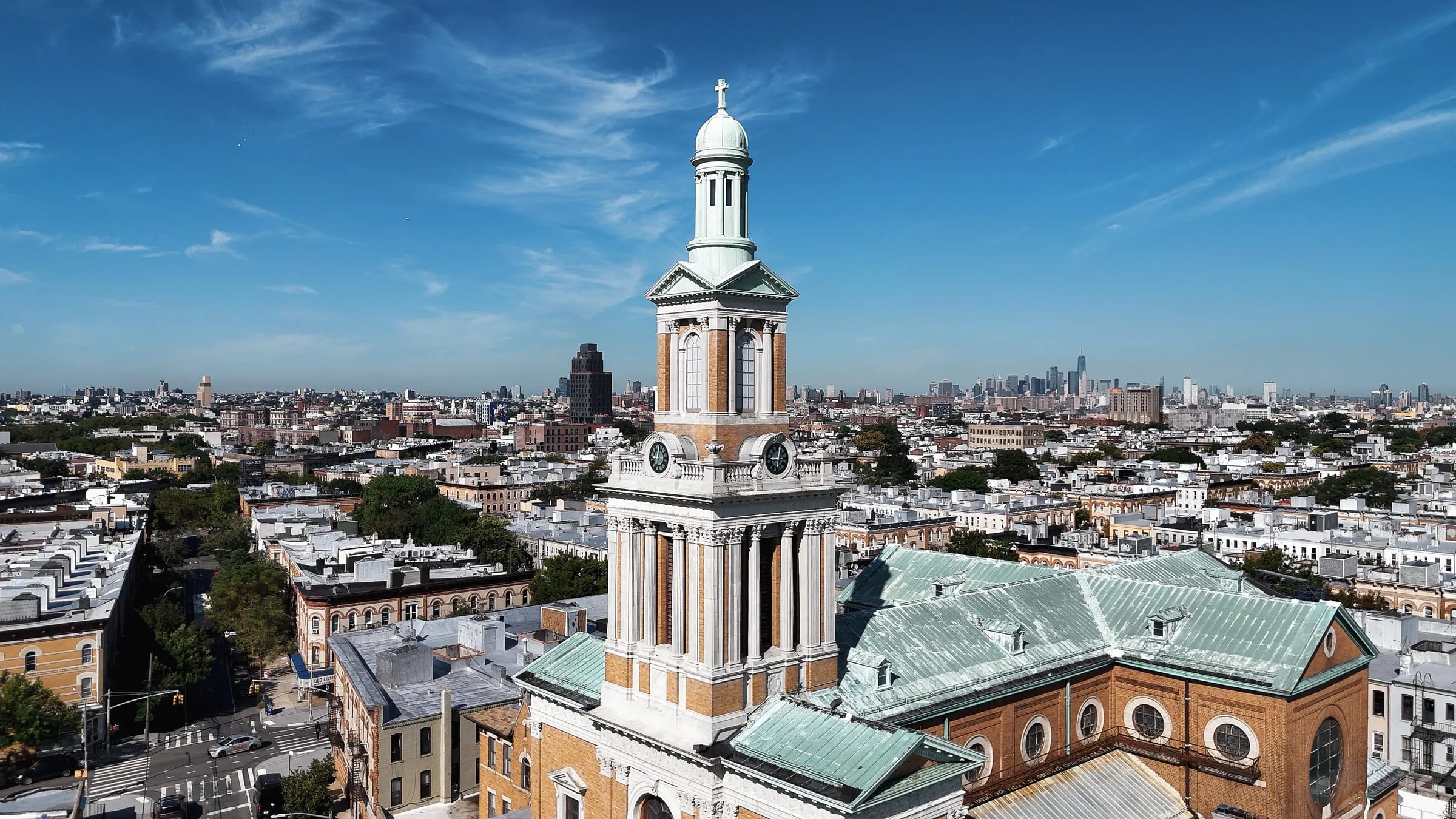 St. Matthias Church and the New York City skyline viewed from above Ridgewood, Queens