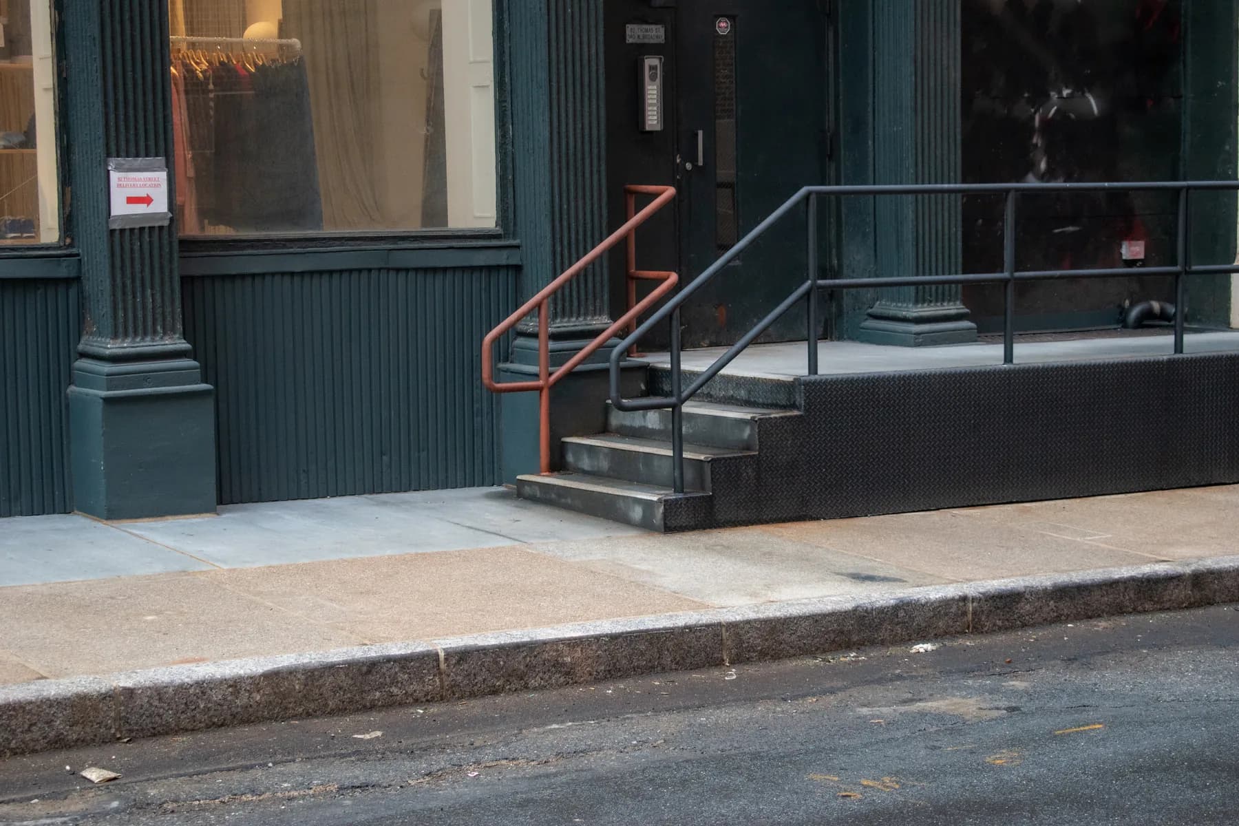 Completed accessible entrance, steps, and railings at 140 Broadway