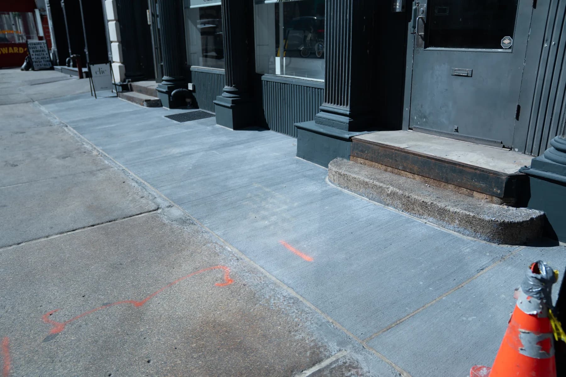New sidewalk and restored street-level approach at 140 Broadway