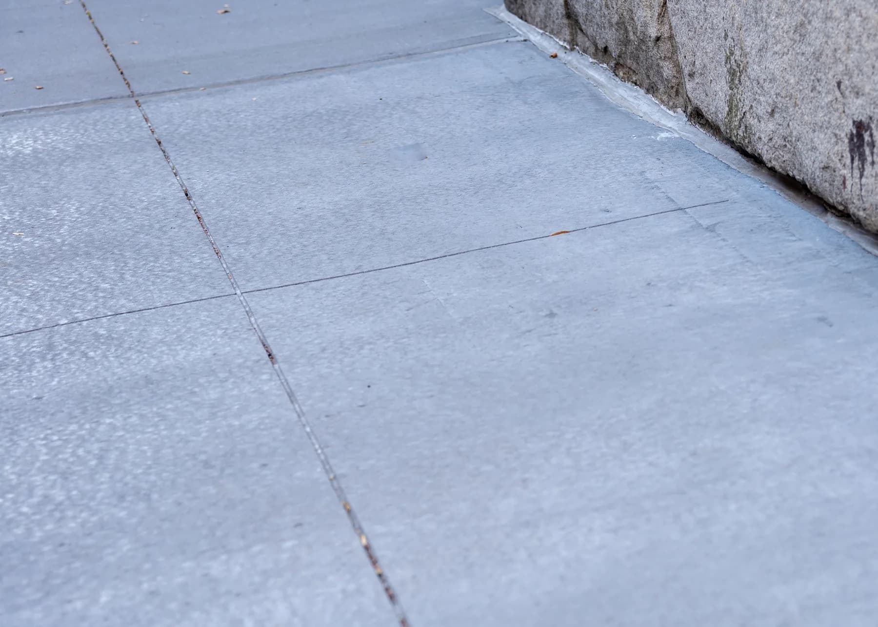 Close view of the finished concrete surface and control joints
