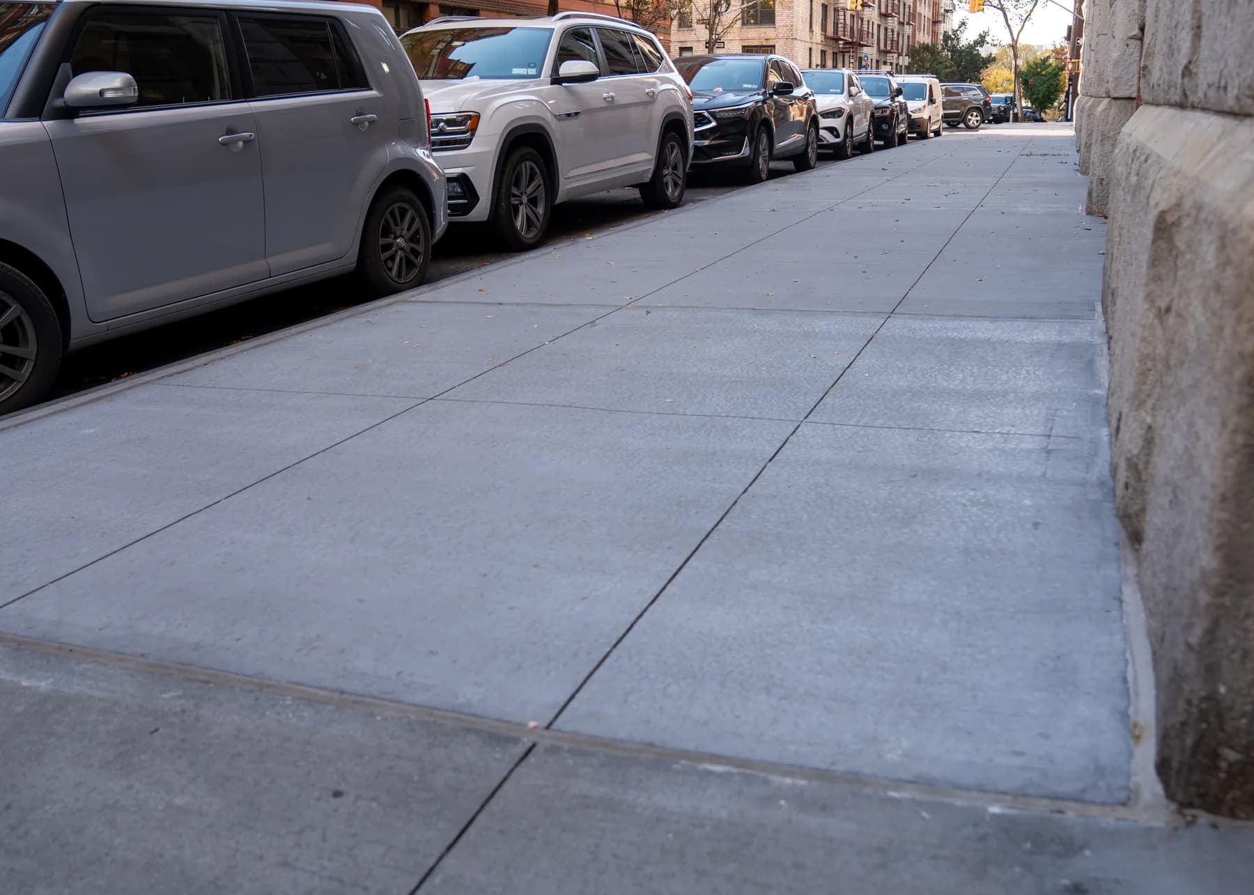 Long concrete sidewalk run beside 275 West 10th Street
