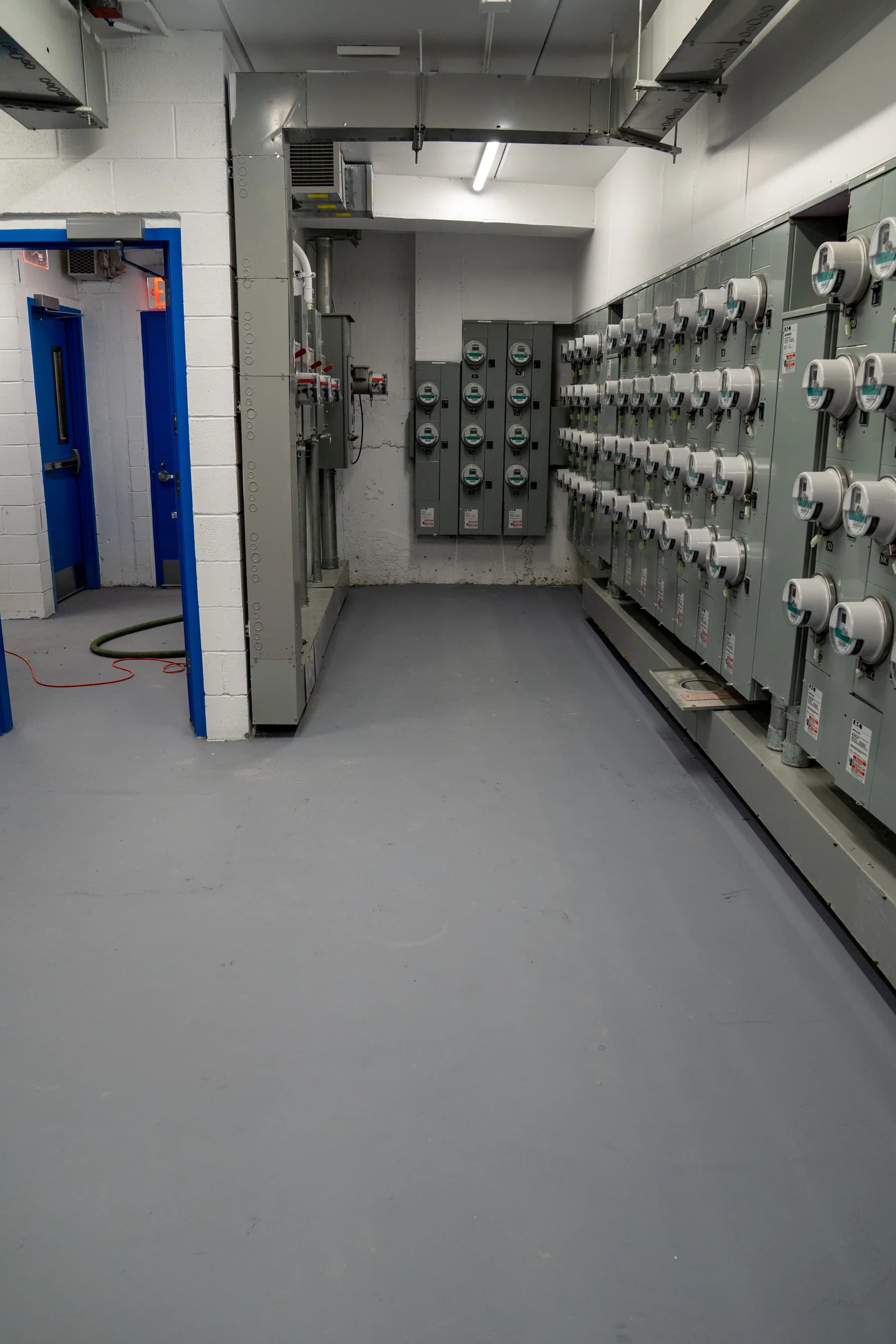 Finished utility-room floor installed around electrical cabinets