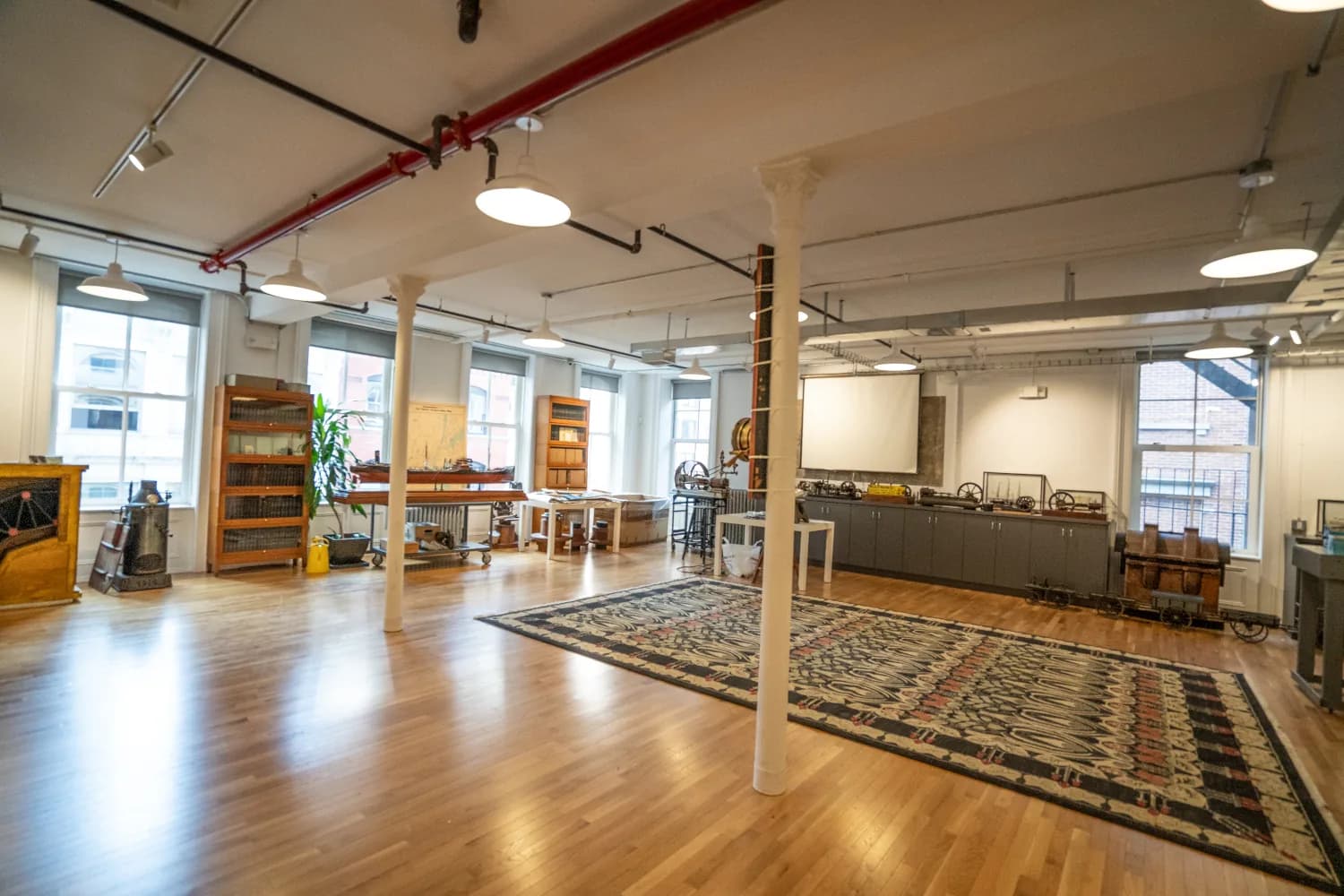 Finished loft interior with exposed services and wood floors